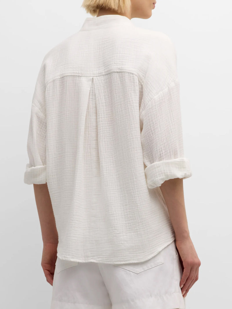 A rear view of the Finley Elsa blouse, a double gauze v-neck cotton white popover blouse with a relaxed fit.