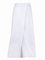 A front view of the Finley wrap skirt, a women's white linen maxi wrap skirt with a straight silhouette and a button closure.