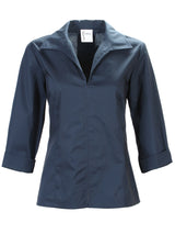 A front view of the Finley swing shirt, a 3/4 sleeve navy v-neck popover with a relaxed shape and a back inverted pleat.