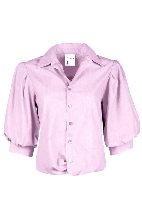 A front view of the Finley Bomba blouse, a light purple button-down shirt with elbow blouson sleeves and a front twist hem detail.