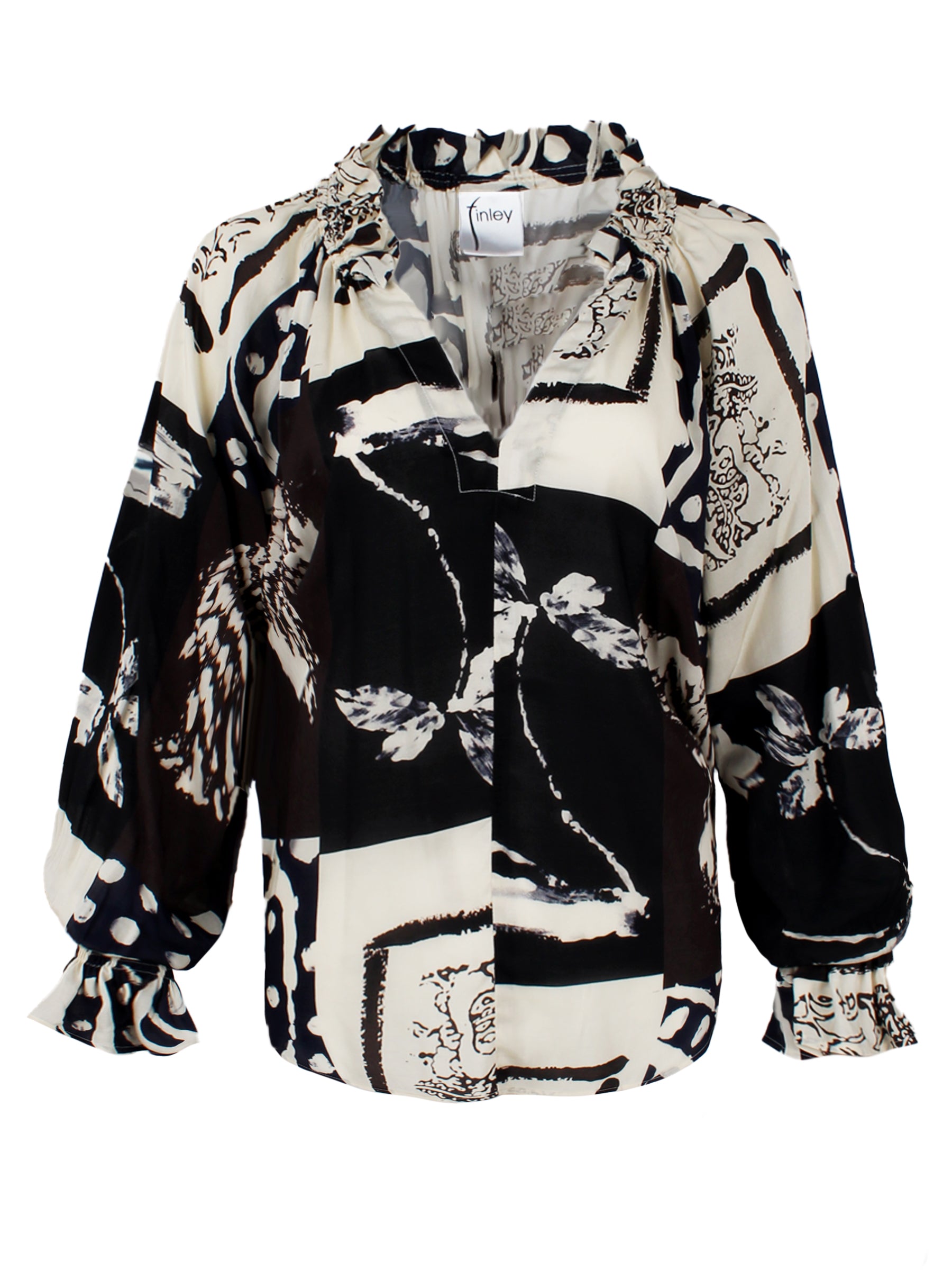 A front view of the Candace blouse, featuring ruffle trim, a popover design, oversize fit, blouson sleeves, and a black & white Asian abstract print in rayon.
