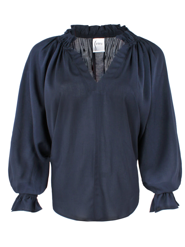 A front view of the Finley Candace blouse, a navy blue viscose voile popover top with long blouson sleeves and a v-neck.