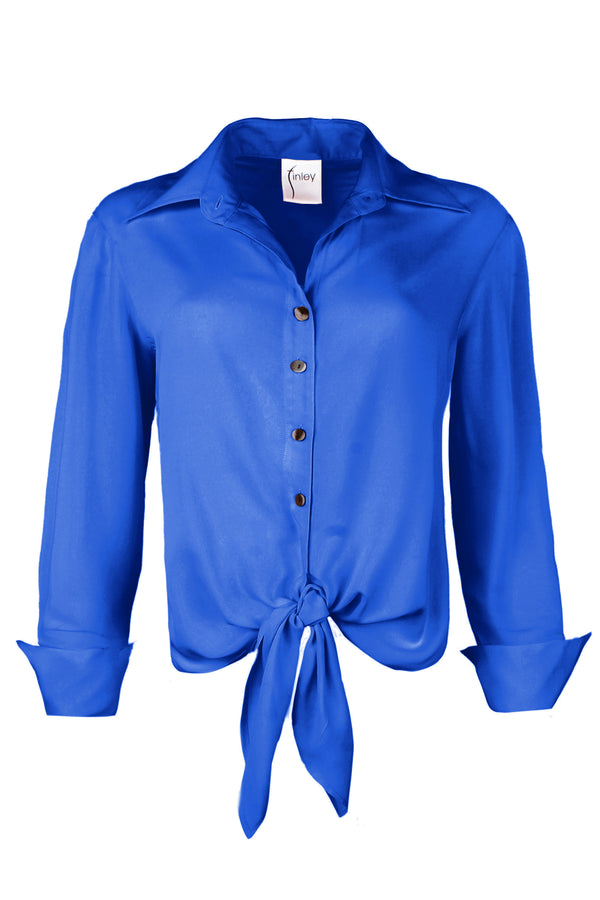 A front view of the Finley Lindy blouse, a royal blue viscose voile tie-front top with a faux French cuff and a relaxed shape.