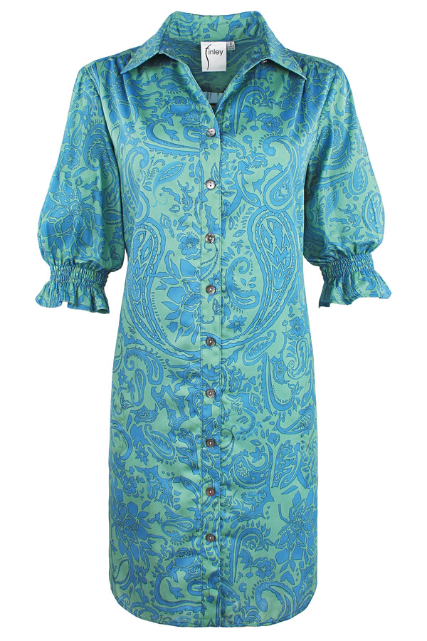 A front view of the Finley Miller dress, a button down shirt dress with short puff sleeves in a teal paisley print