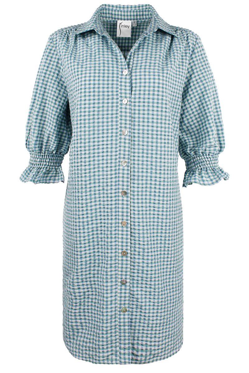 A front view of the Finley Miller dress, a button down shirt dress with short puff sleeves in a blue green seersucker print.