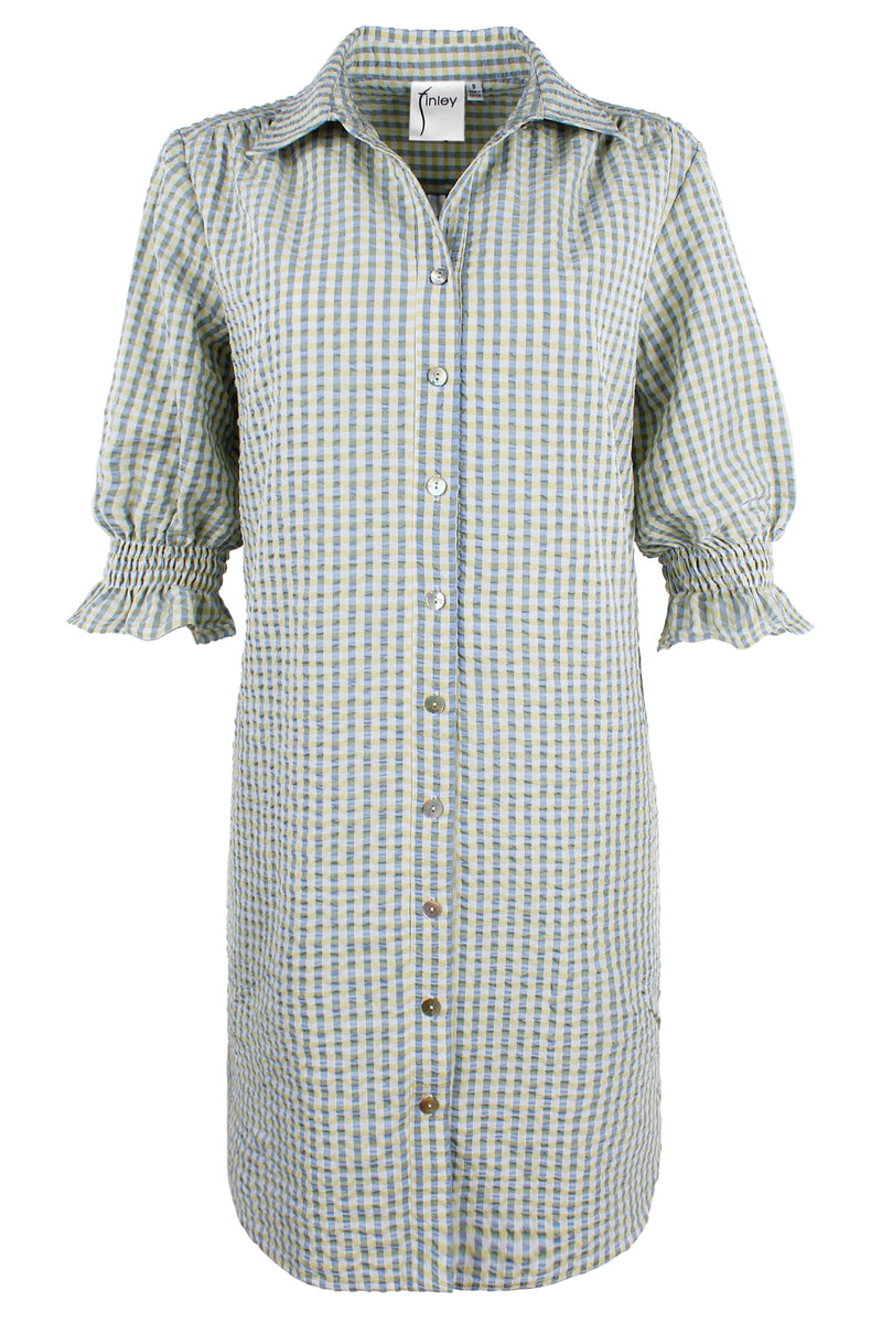 A front view of the Finley Miller dress, a button down shirt dress with short puff sleeves in a blue green seersucker print.