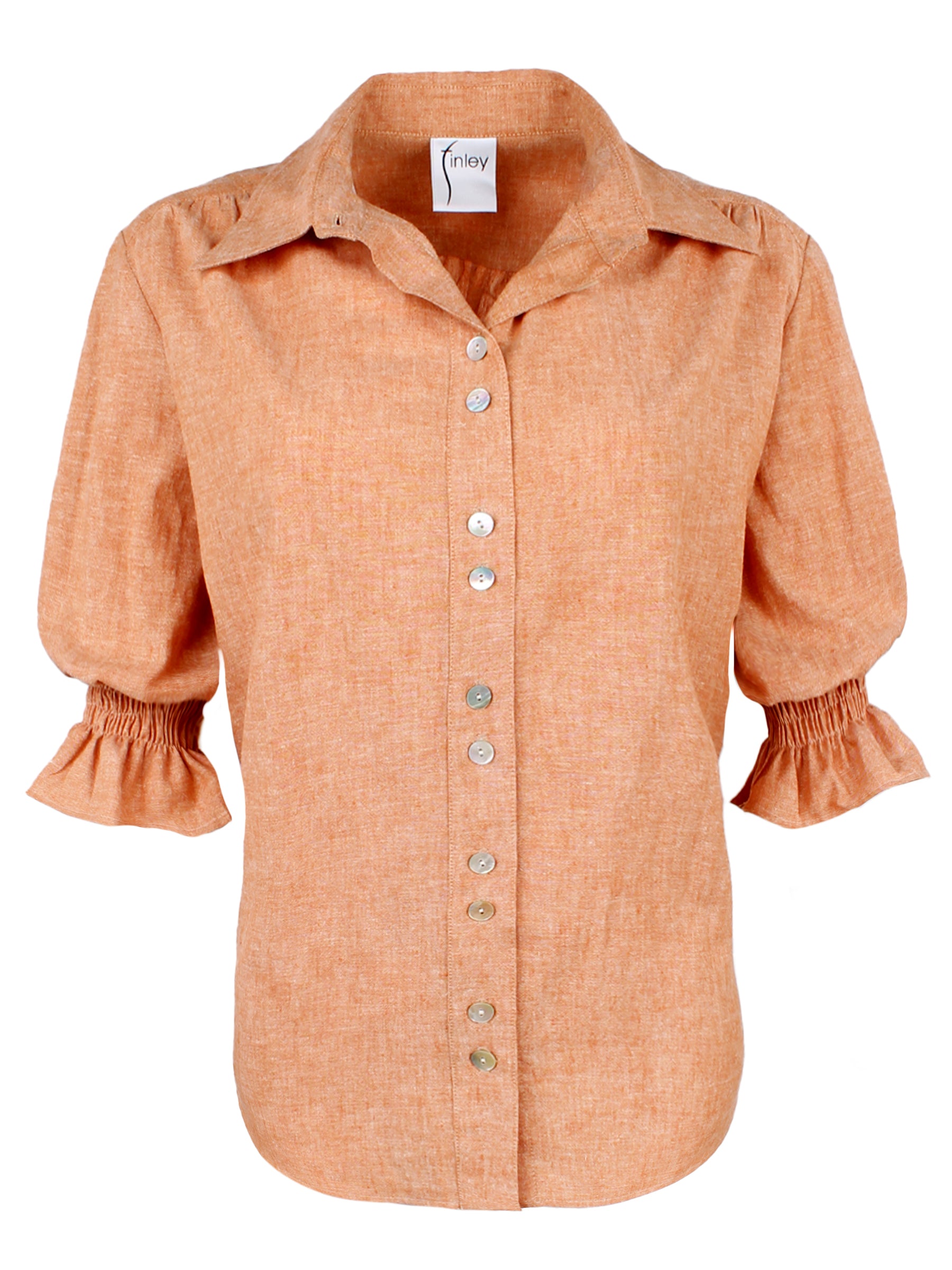 A front view of the Sirena shirt in rust orange, featuring elbow-length puff sleeves, a hemp cotton blend, spread collar, and a relaxed shape.
